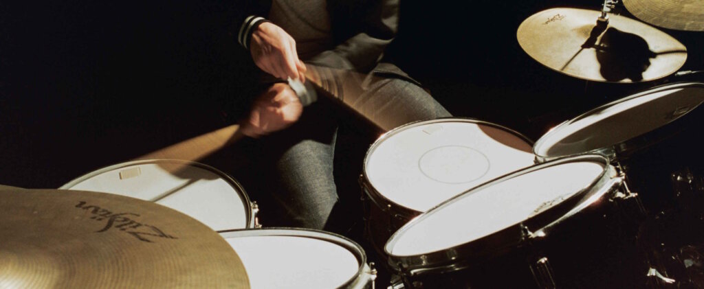 Drummer, Wearing a Black Jacket and Jeans